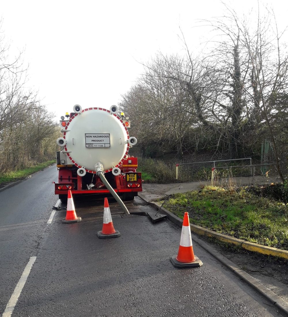 Tanker parked at the roadside with cones while working